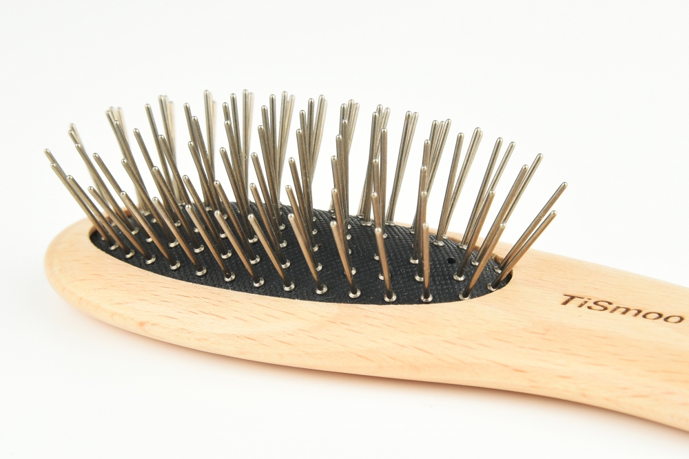 Titanium dolphin-shaped hairbrush